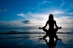 WomanMeditatingOnBeach